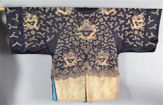 A Chinese midnight blue silk dragon robe, length 115cm